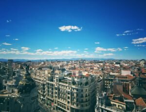 pexels-photo-670261-670261 A breathtaking aerial view of Madrid's vibrant cityscape under a clear blue sky.